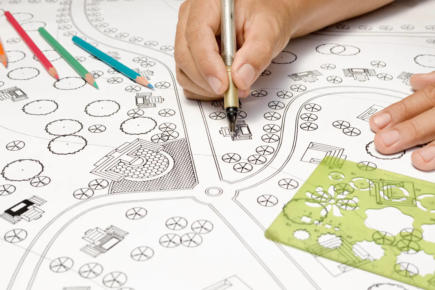 Landscape design artist drawing a plan for a new installation.